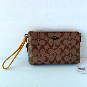 Coach NWT Wristlet Signature Print With Yellow LeatherStrap and zipper